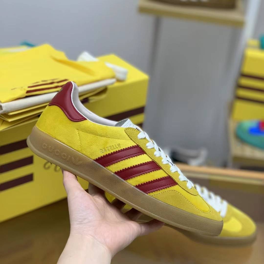 GU*I× Adidas sneakers