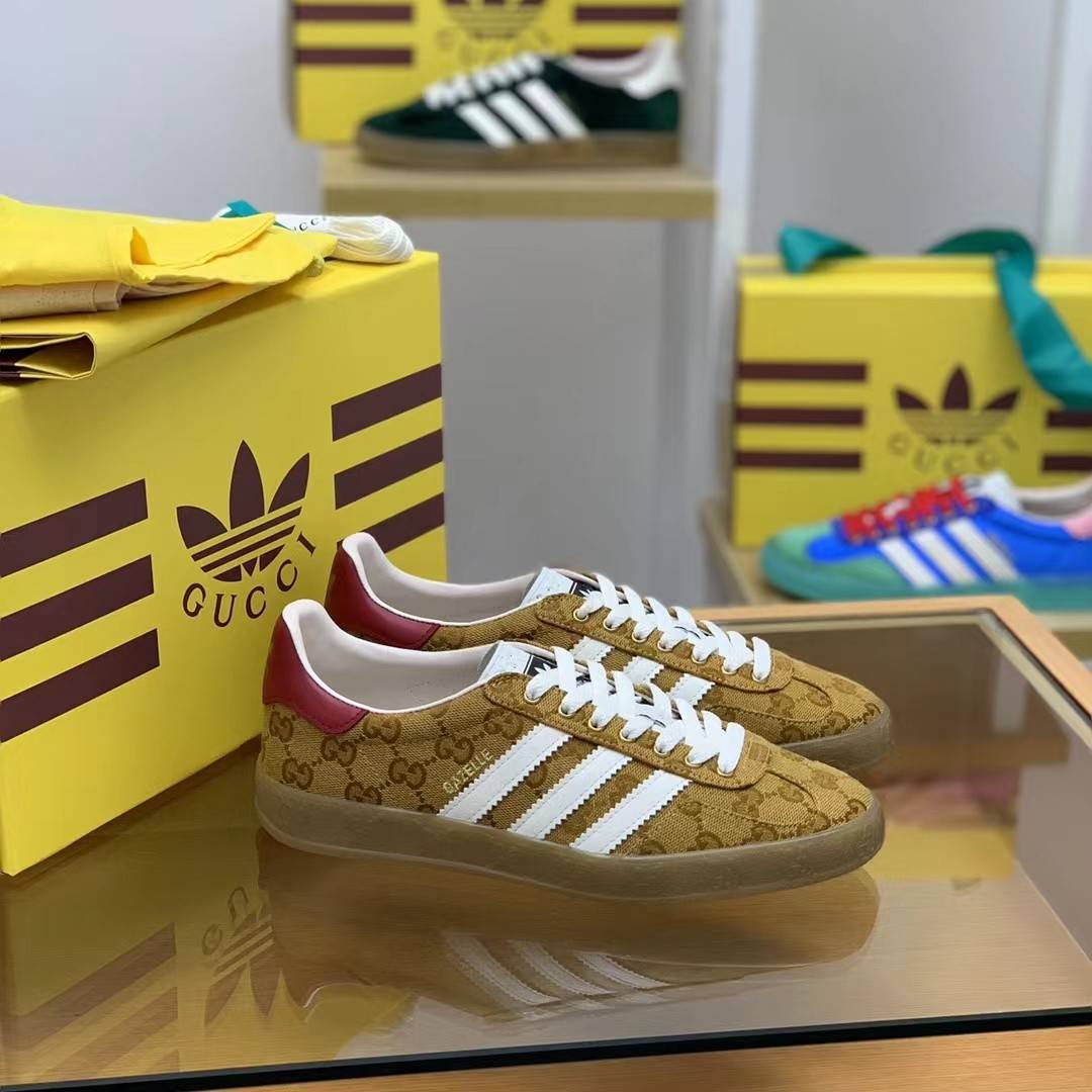 GU*I× Adidas sneakers