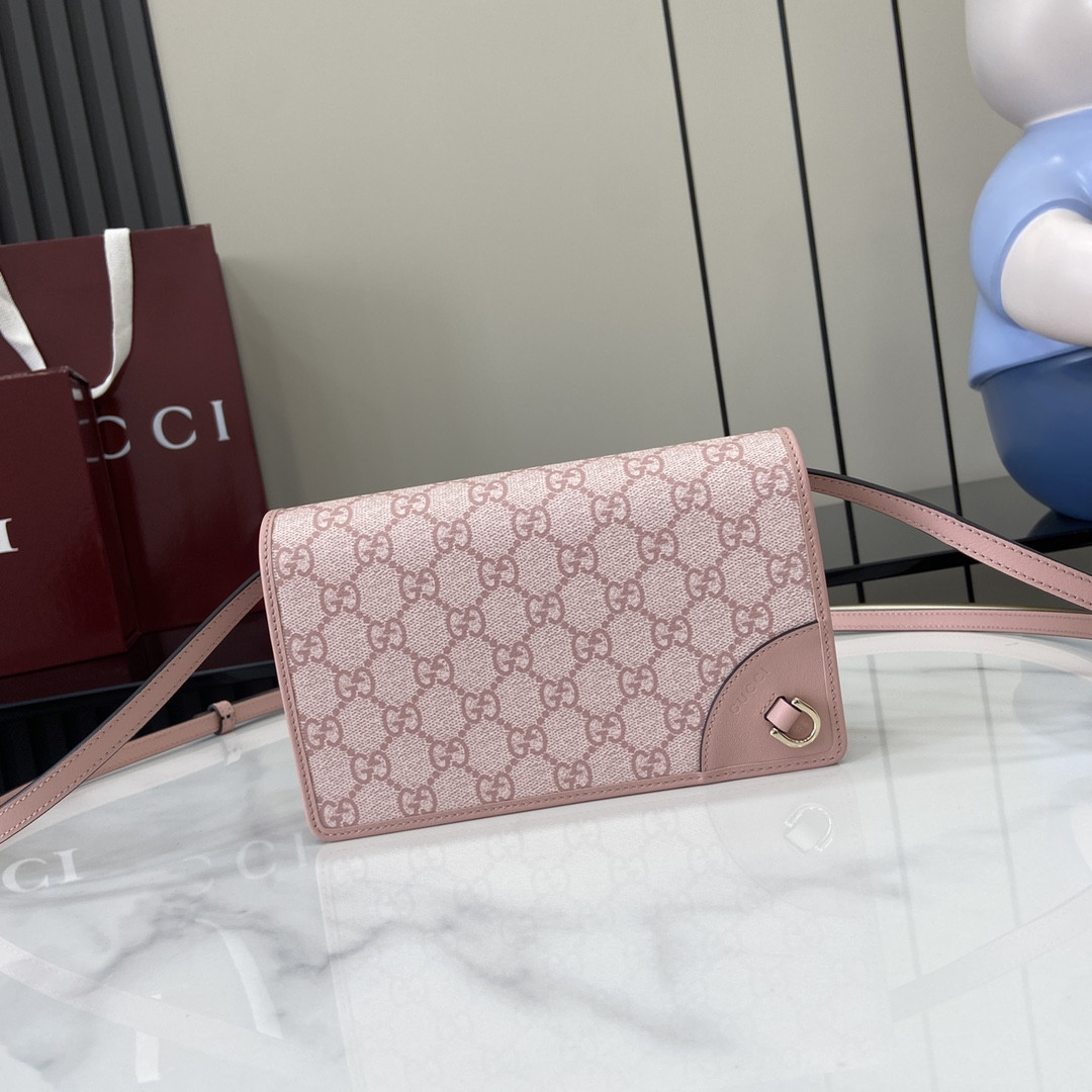 G*u*i emblem handbag
