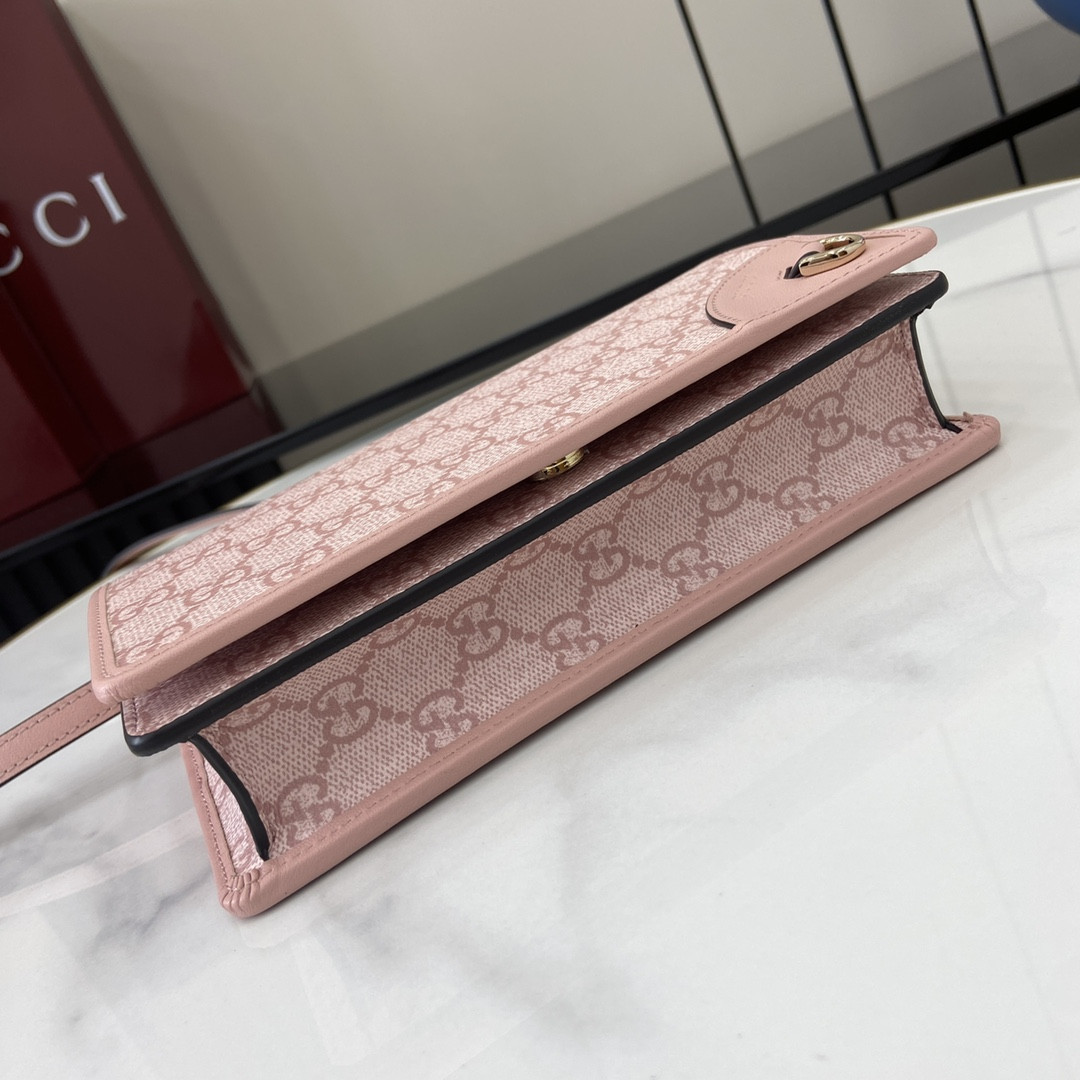 G*u*i emblem handbag